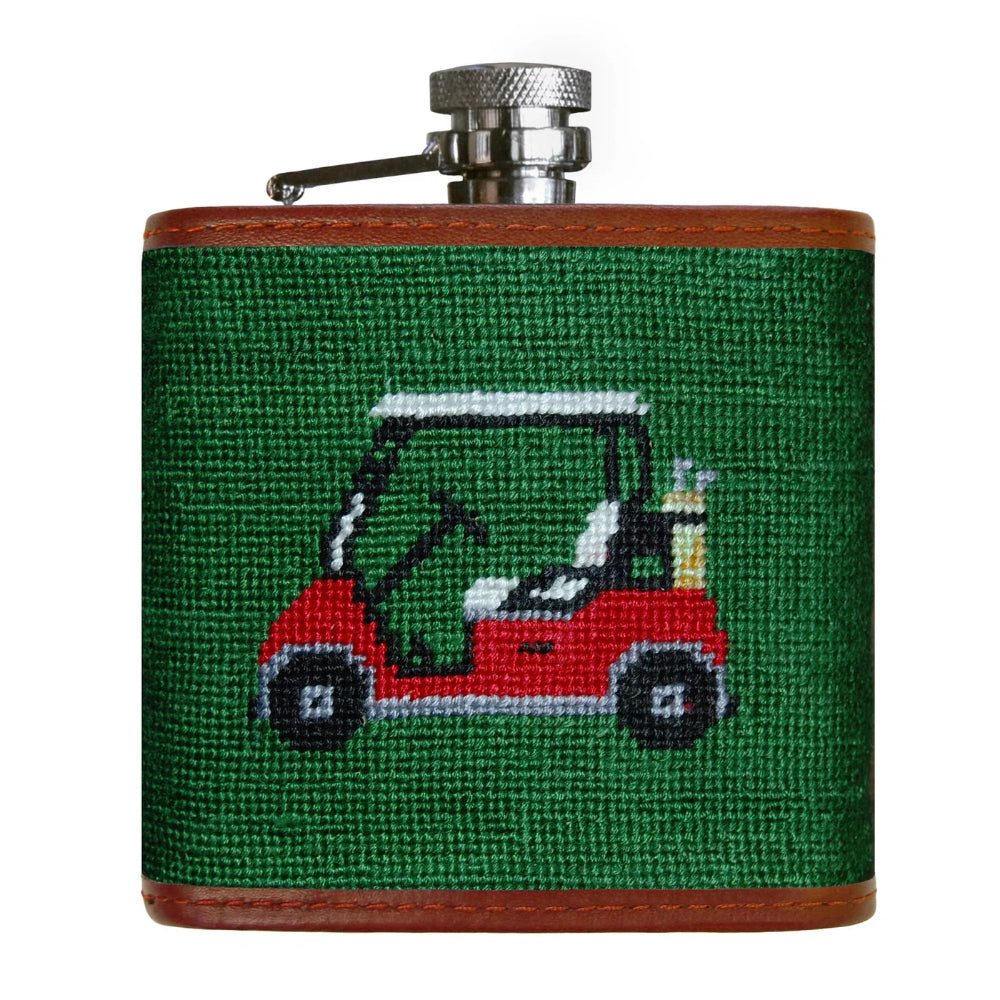 Flask with golf cart design on a green background