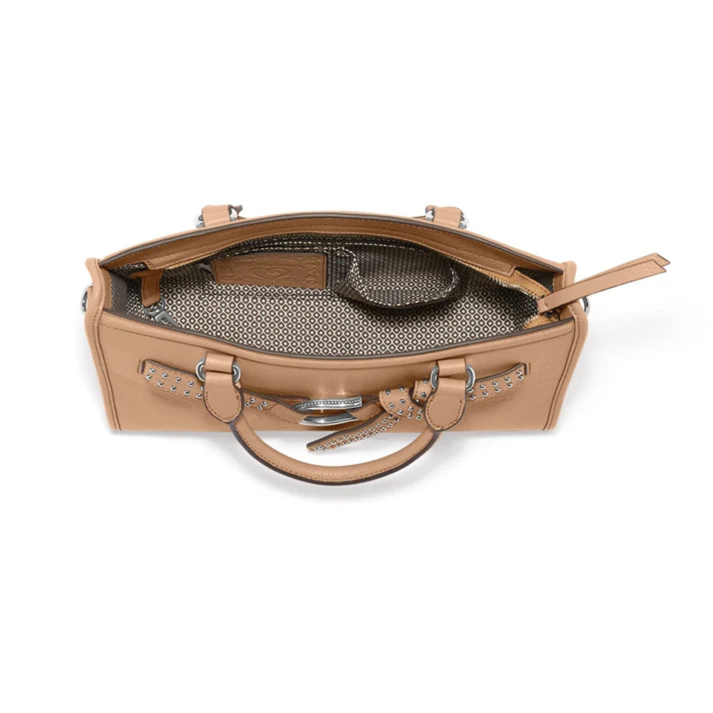 A tan leather handbag shown open from a top-down view, revealing a patterned gray and black interior lining, silver-tone hardware, and a top handle on a plain white background.