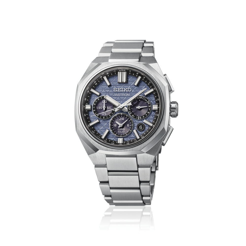 Silver Seiko watch with a blue face on a white background