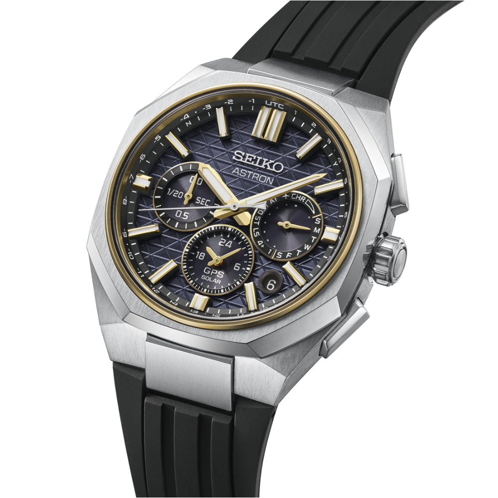Seiko Astron watch with black rubber strap on a white background