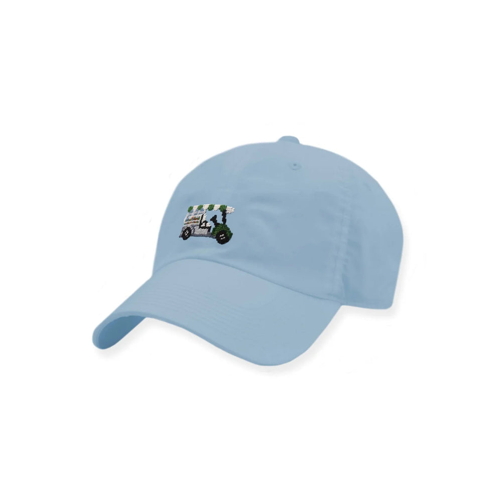A light blue baseball cap featuring a small embroidered golf cart graphic on the front, set against a plain white background.
