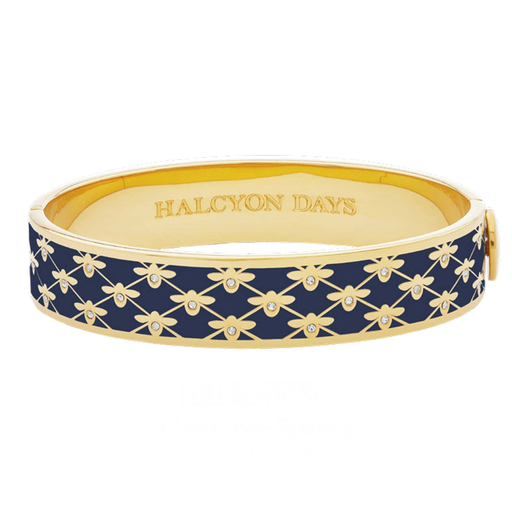 Gold and blue bracelet with floral pattern on a white background