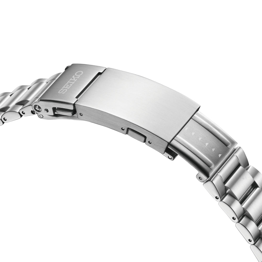 Close-up of a silver watch band with Seiko logo on a white background