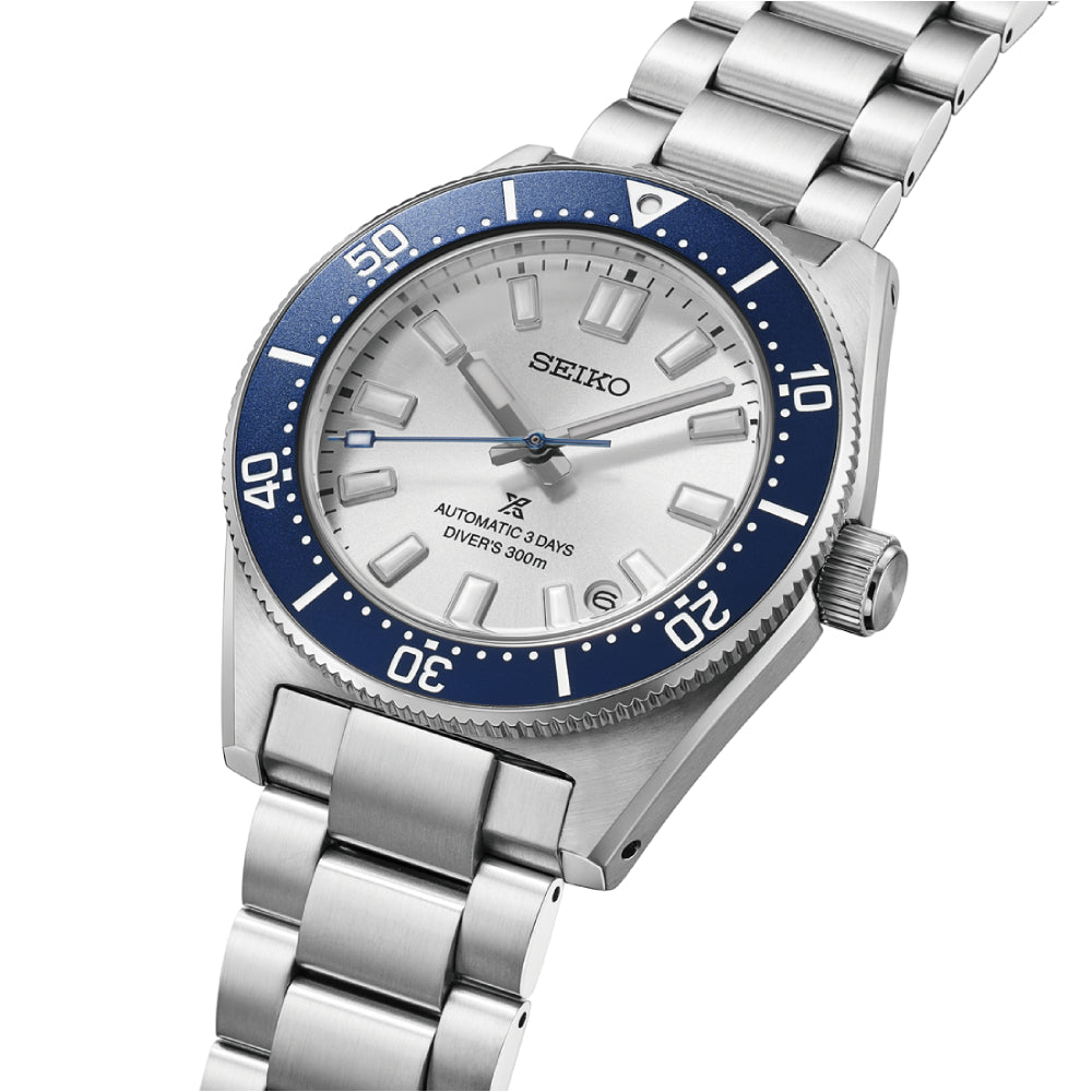 seiko prospex 145th anniversary limited edition watch with a silver dial and blue stainless steel bezel on a white background