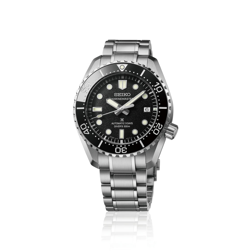 Seiko watch with black dial and silver metal bracelet on a white background