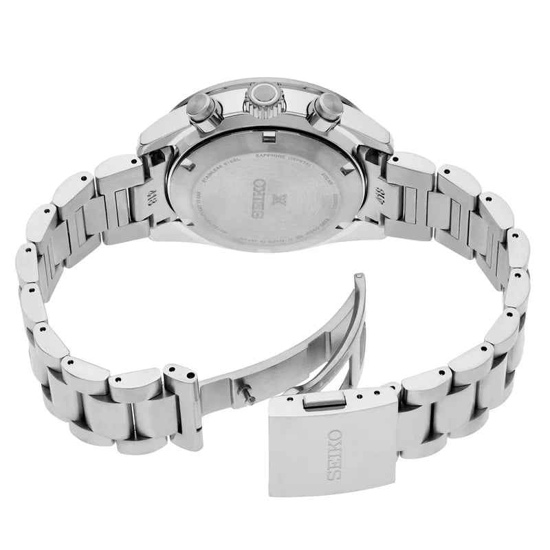 The back view of a stainless steel Seiko watch with a metal link bracelet, showing the case back, crown, and clasp engraved with the Seiko brand name.