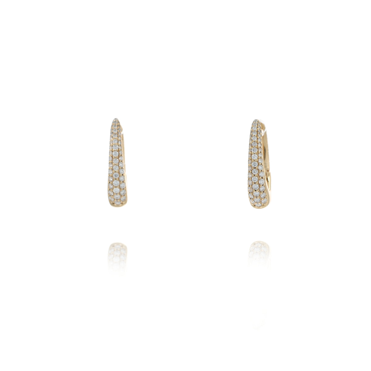 A pair of gold huggie hoop earrings with pave set stones, shown on a clean white background with a soft reflection below.