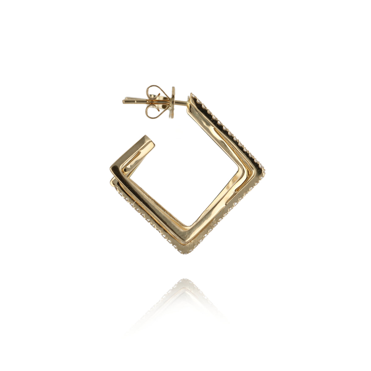 Side view of A pair of gold hoop earrings with a twisted, geometric design set with small clear stones, shown against a plain white background with a soft reflection below.