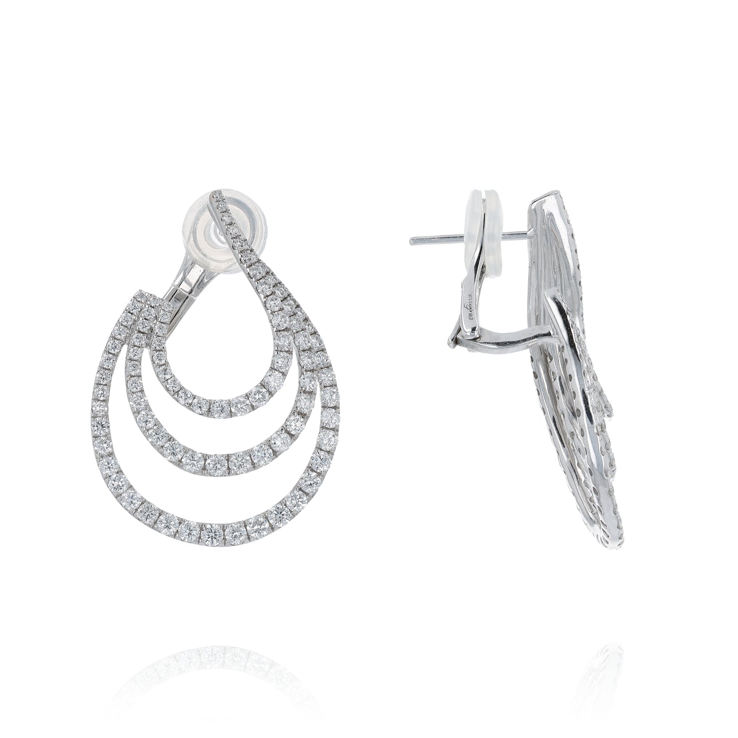 White gold 3 row diamond earrings on a white background