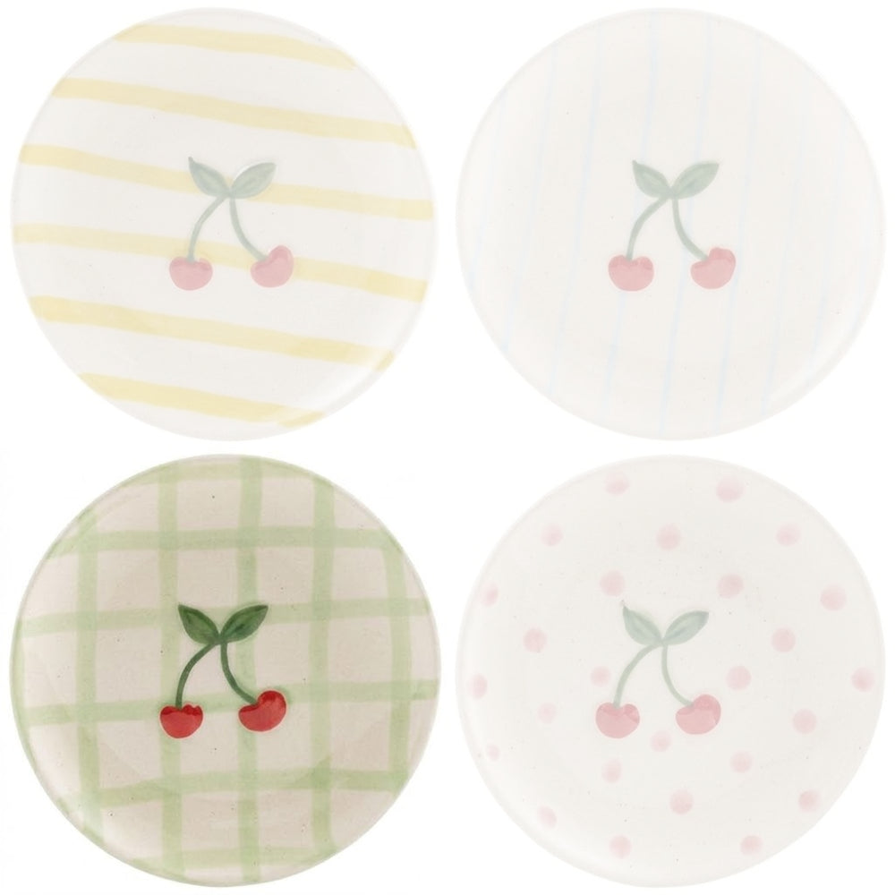 Ceramic plate with a cherry design on and green square stripes on a white background.