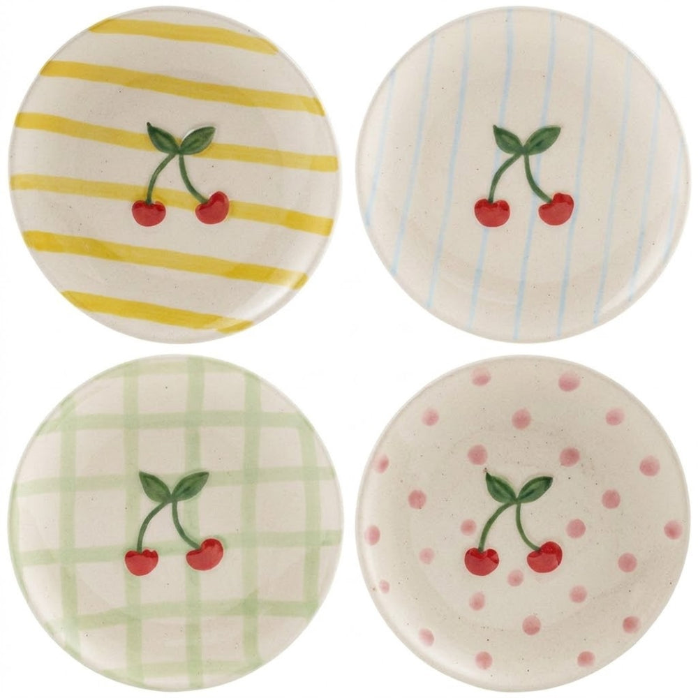 Four ceramic coasters with cherry design on a white background