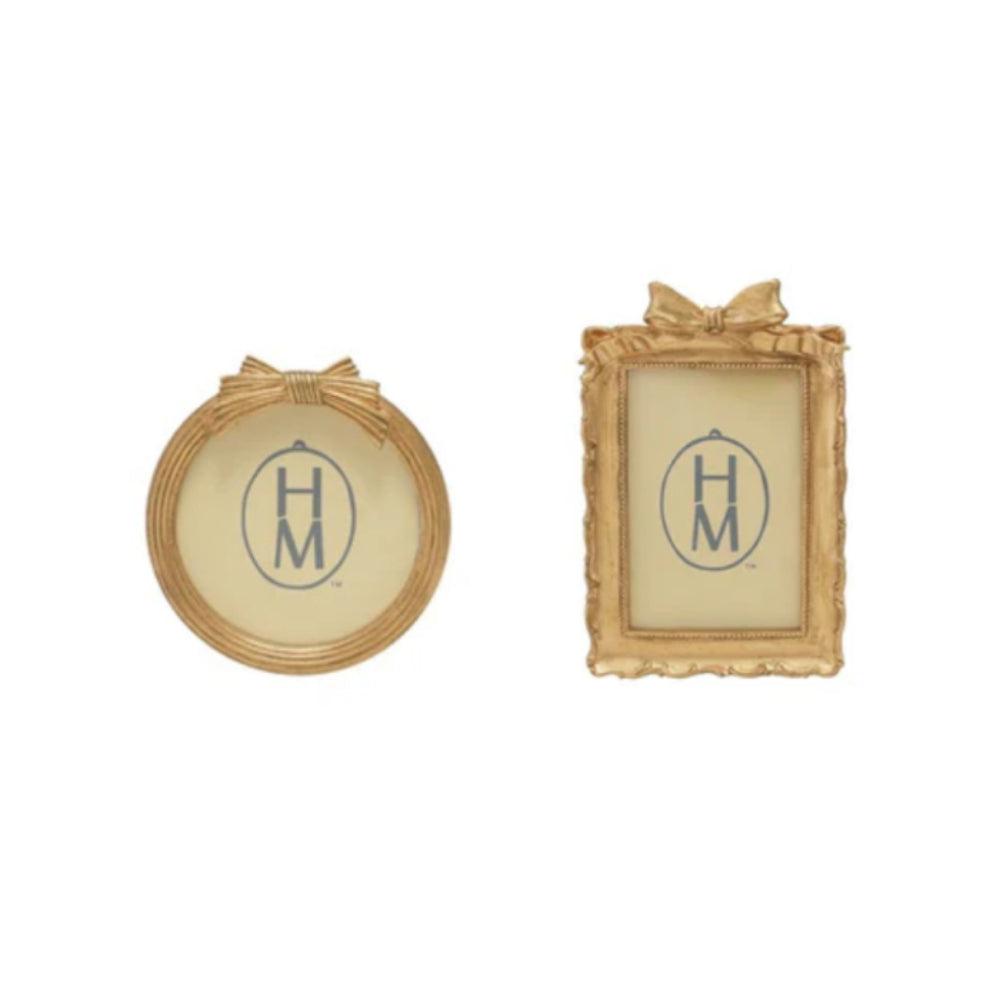 Two decorative gold frames in round & rectangle with a gold bow on top on a white background.