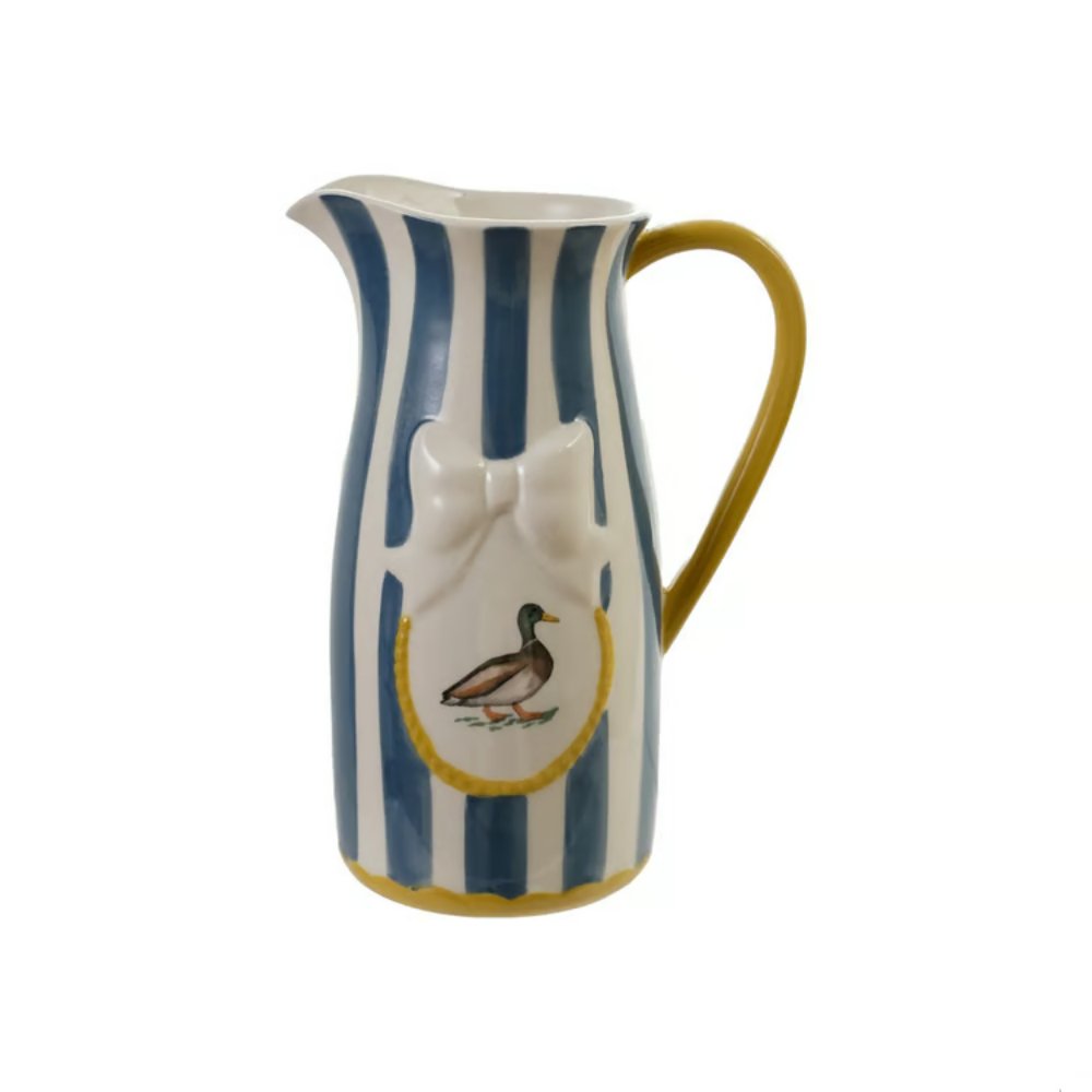 Ceramic pitcher with blue and white striped design and duck illustration on a white background