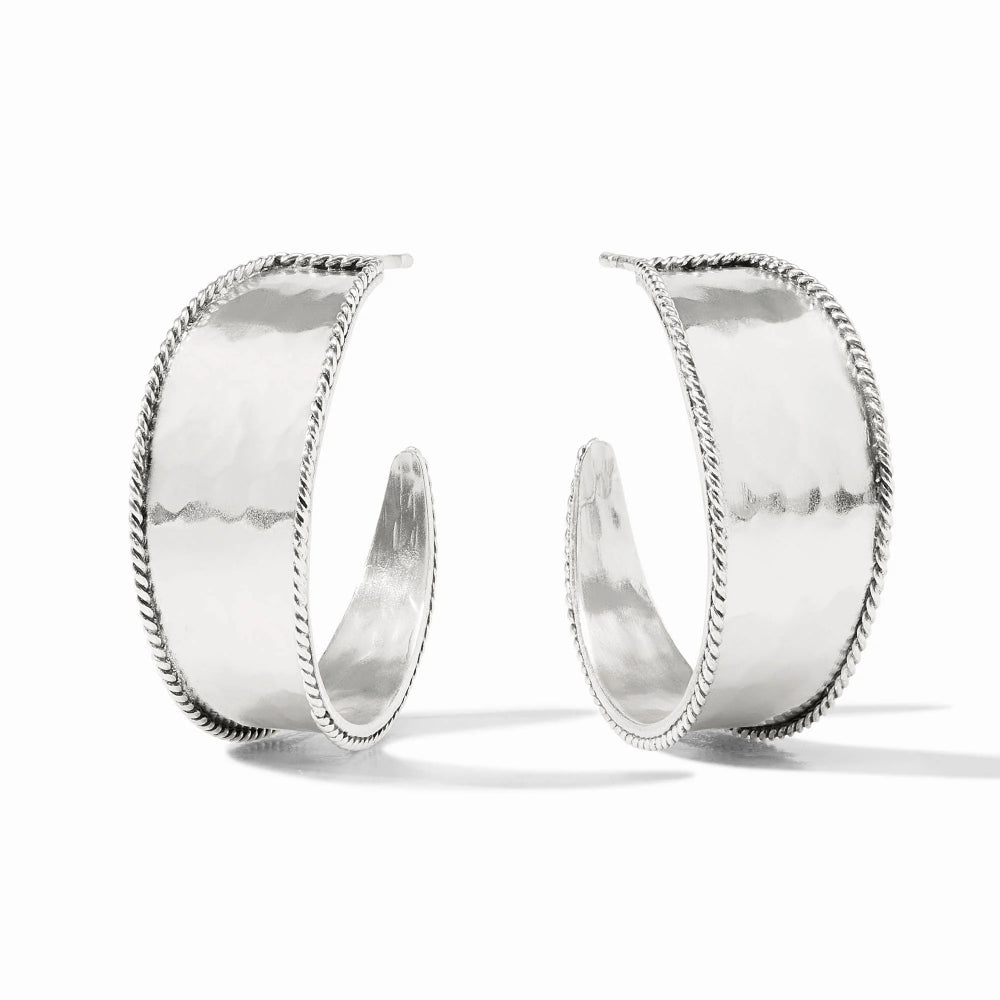 Pair of silver hoop earrings on a white background