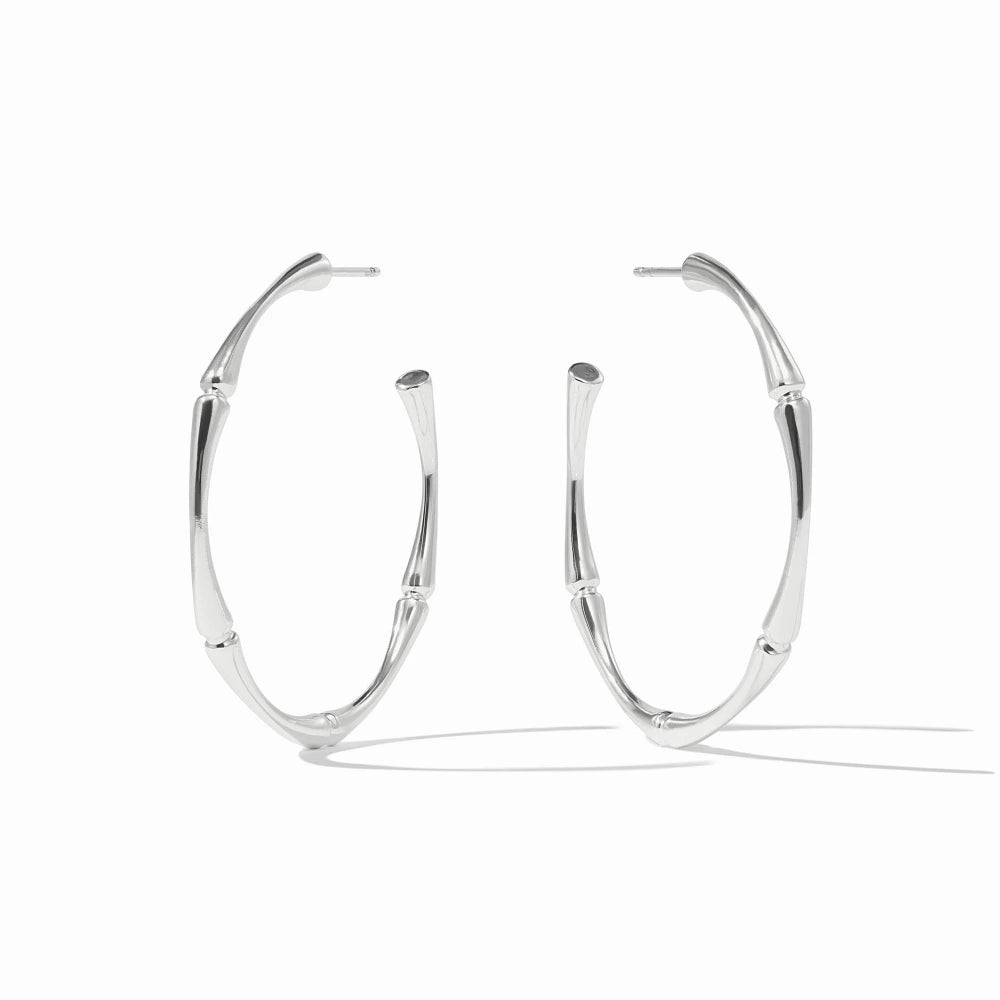 Pair of silver hoop earrings on a white background