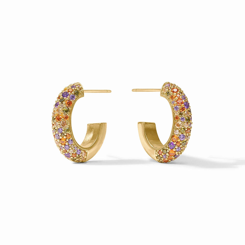 A pair of gold hoop earrings embellished with small, multicolored pavé gemstones, shown on a clean white background.
