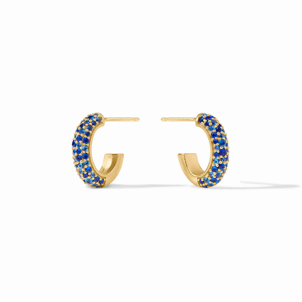 Gold hoop earrings with blue stones on a white background