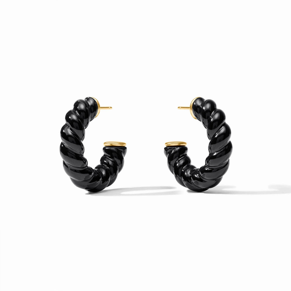A pair of twisted hoop earrings in glossy black with gold post and backings, displayed on a clean white background.