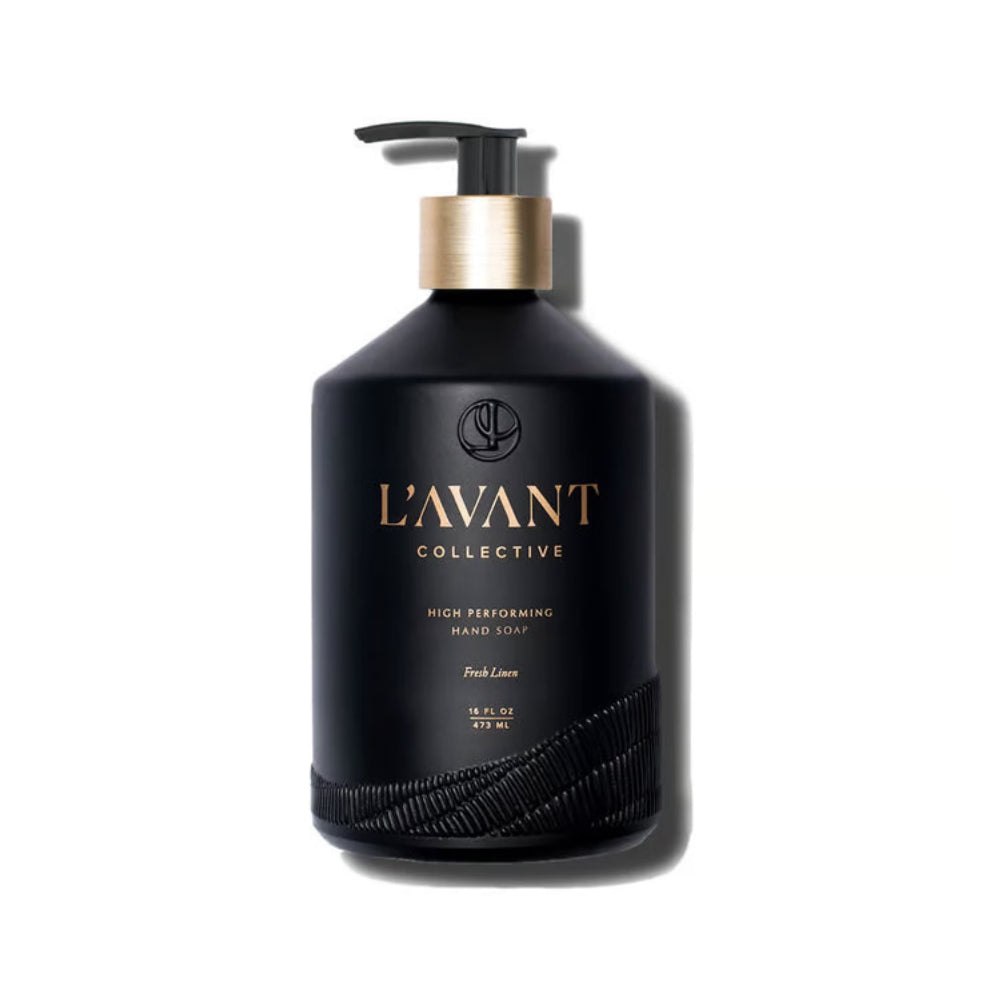 A matte black pump bottle of L'Avant Collective Fresh Lime hand soap with a metallic gold collar and gold lettering, set against a plain white background with a soft shadow.