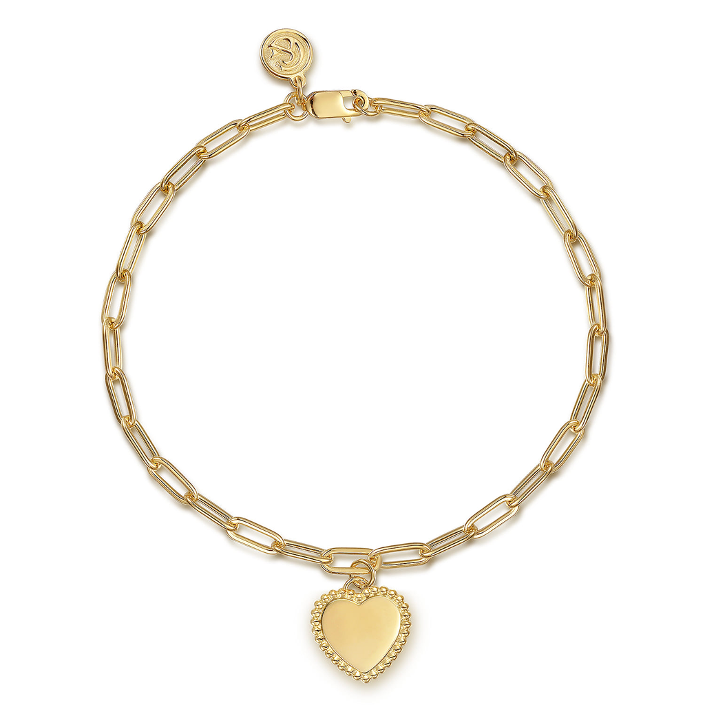 gold bracelet with heart drop on white background