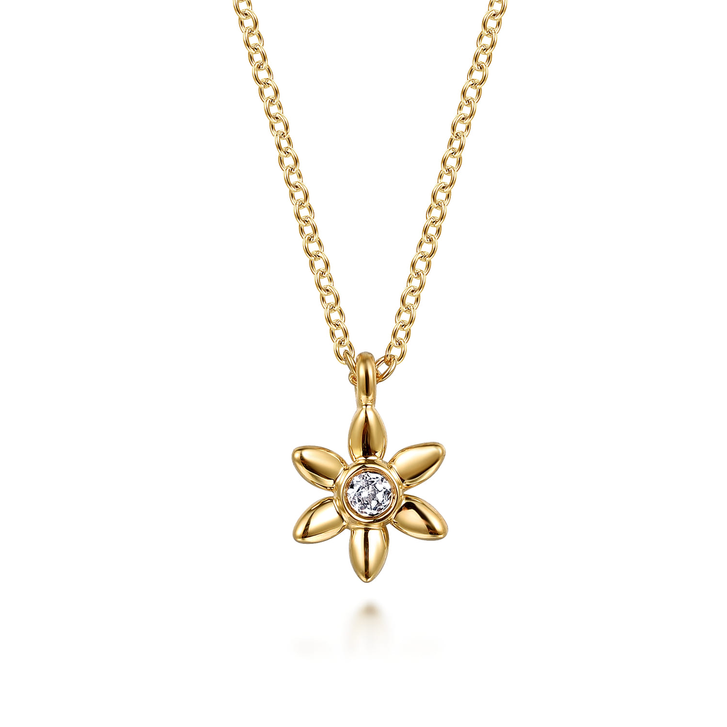 gold pendant necklace on white background
