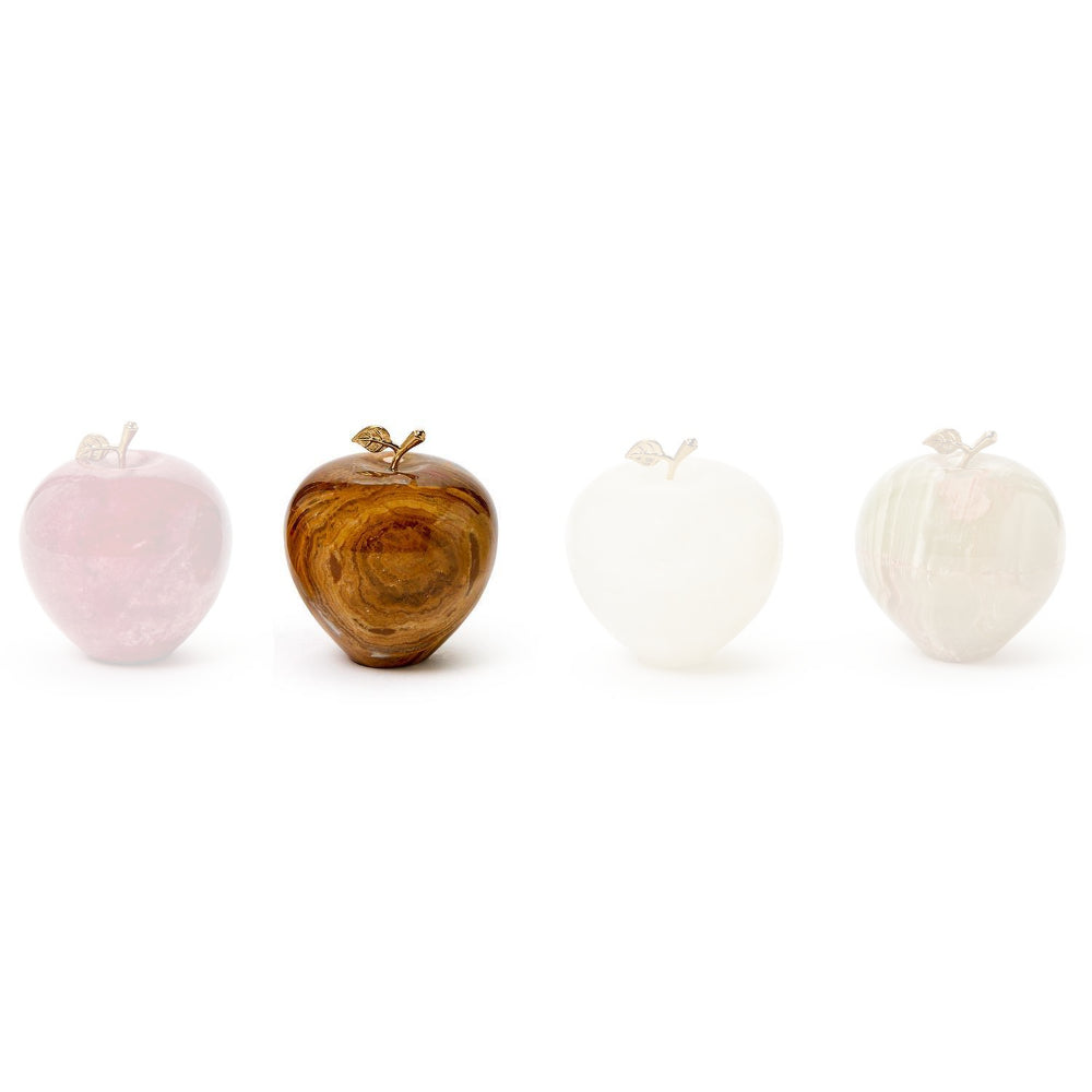 Agate polished stone apple paperweight in with a small gold leaf and stem on a white background.