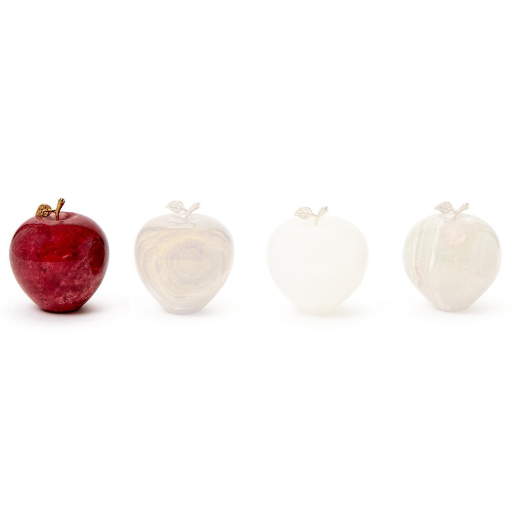 Red polished stone apple paperweight in with a small gold leaf and stem on a white background.