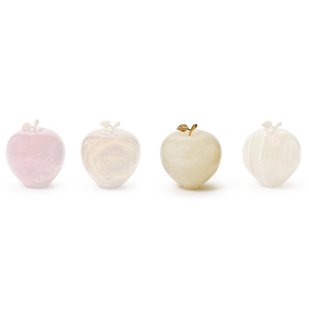 White polished stone apple paperweight in with a small gold leaf and stem on a white background.