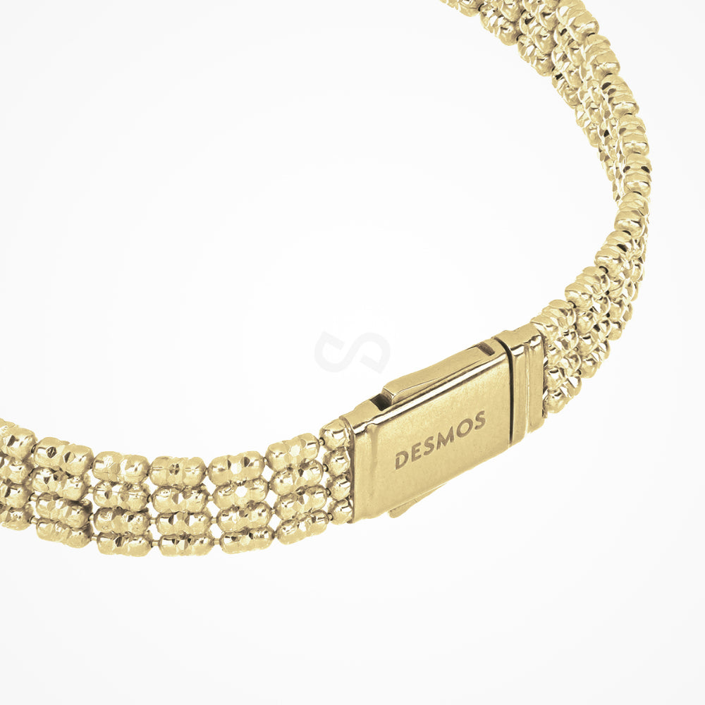 Gold bracelet with a clasp on a white background