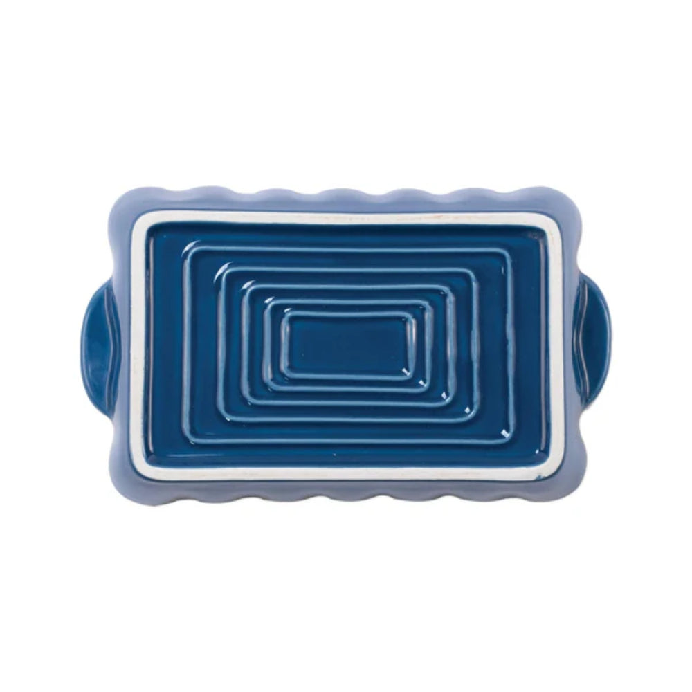 Blue ceramic bottom of baking dish with handles on a white background