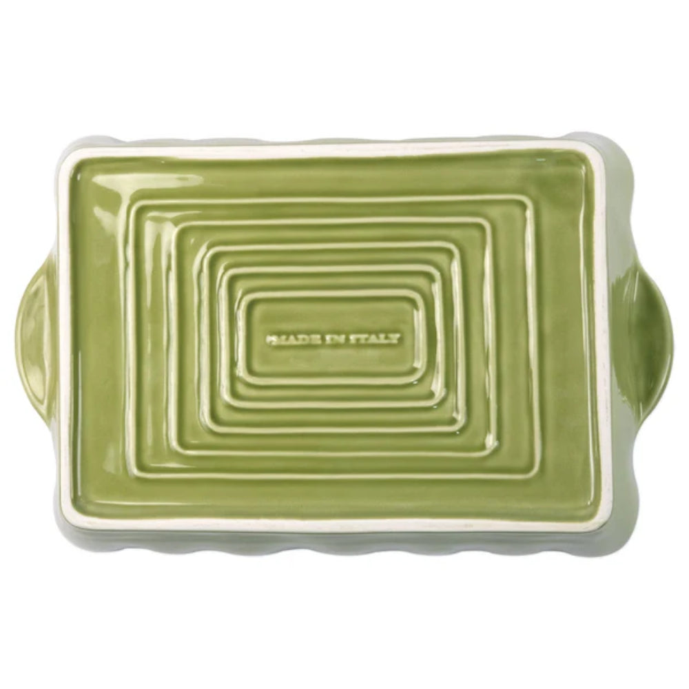 Bottom photo of the large green rectangular baking dish with a scalloped edge and gold rim with a white intior on a white background