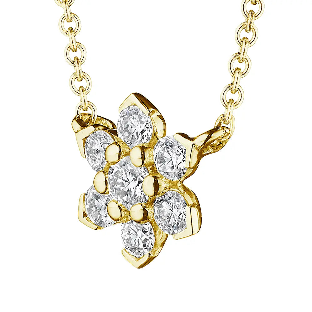 Gold necklace with a diamond flower pendant on a white background