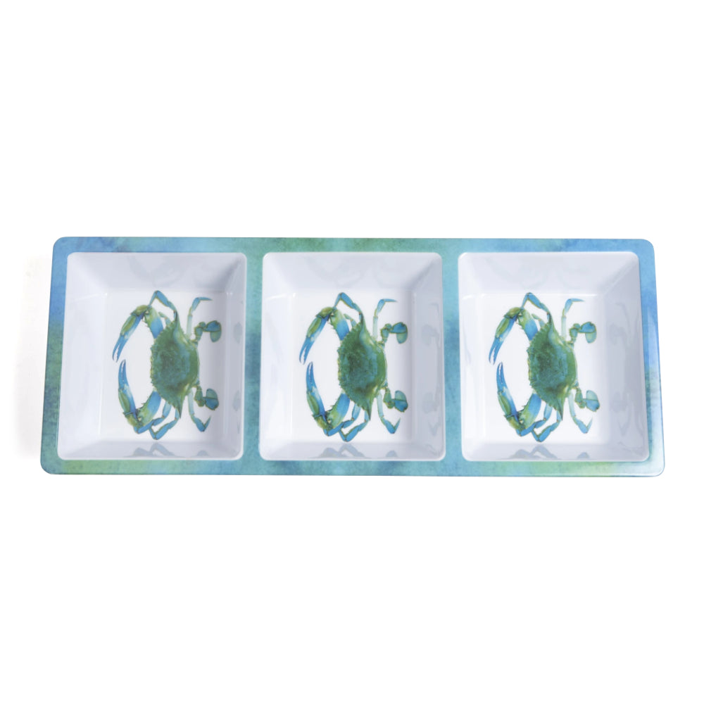 Three-section dish with crab designs on a white background.