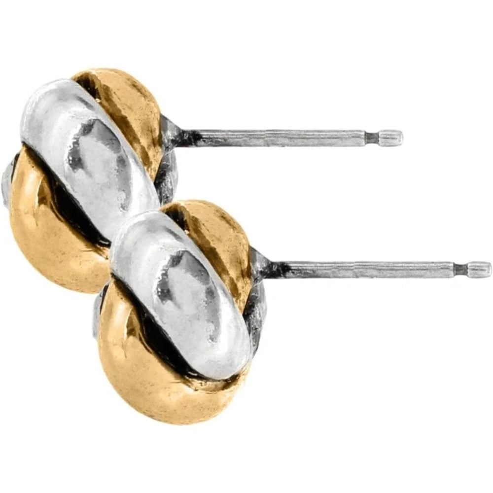 Gold and silver earrings on a white background