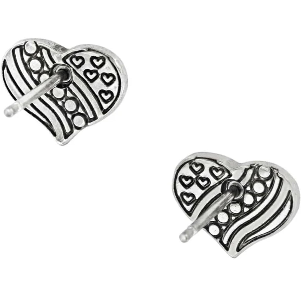 Pair of silver heart-shaped earrings with intricate designs on a white background