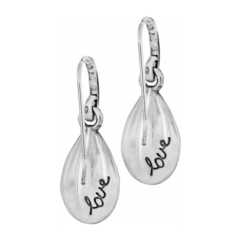 Silver teardrop earrings with 'love' engraving on a white background