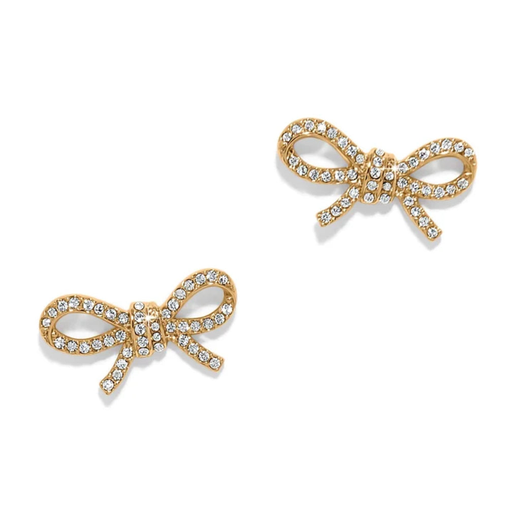 Gold bow-shaped earrings with clear gemstones on a white background