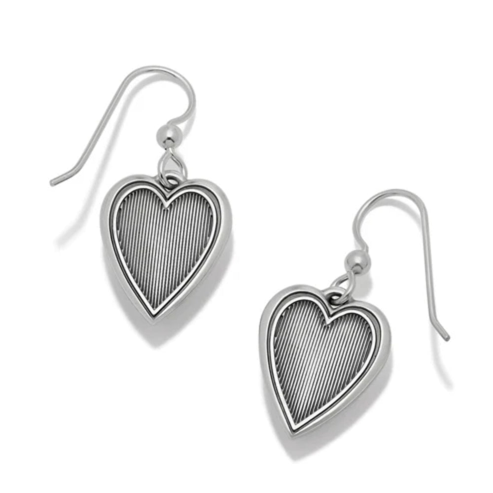 Heart-shaped silver earrings on a white background