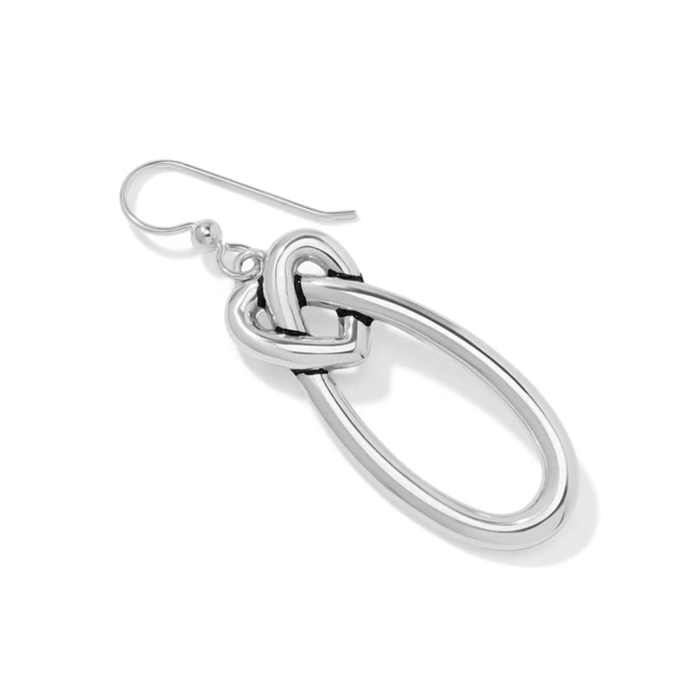 One silver knot earring on a white background