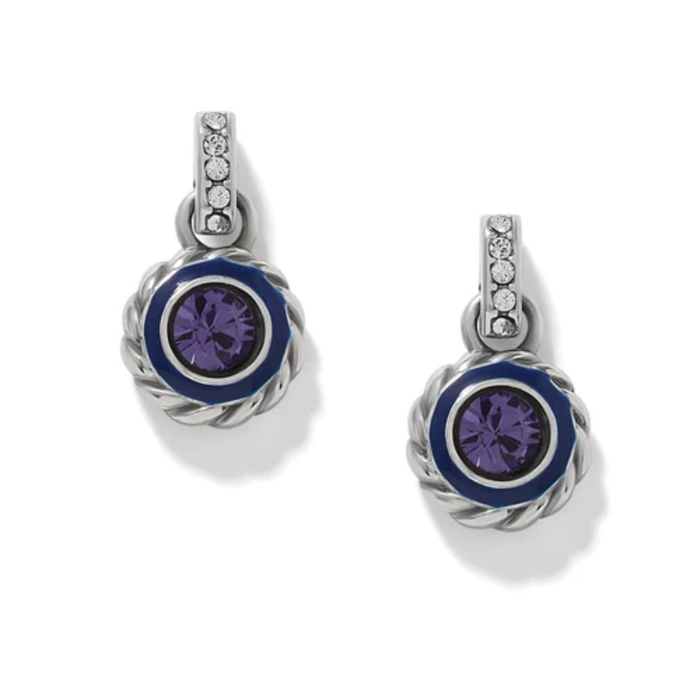 Pair of silver earrings with purple gemstones on a white background