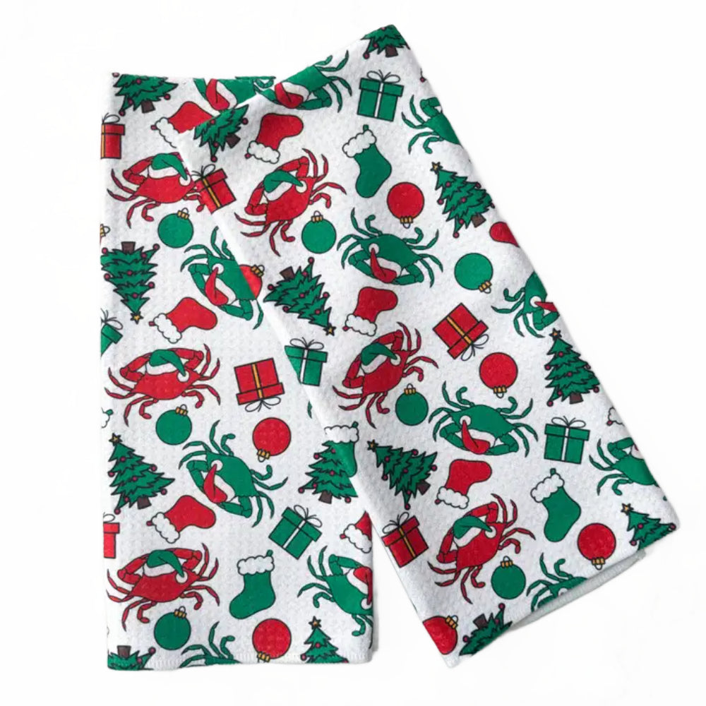 Festive patterned fabric with crabs, trees, and presents on a white background.