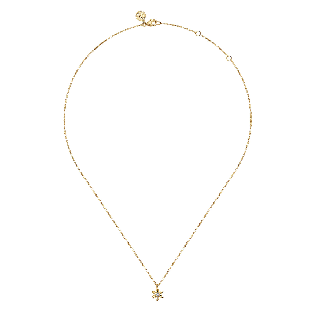gold pendant necklace on white background