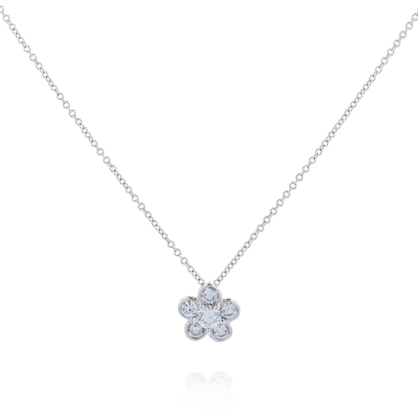 White gold flower shape diamond pendant necklace on a white background