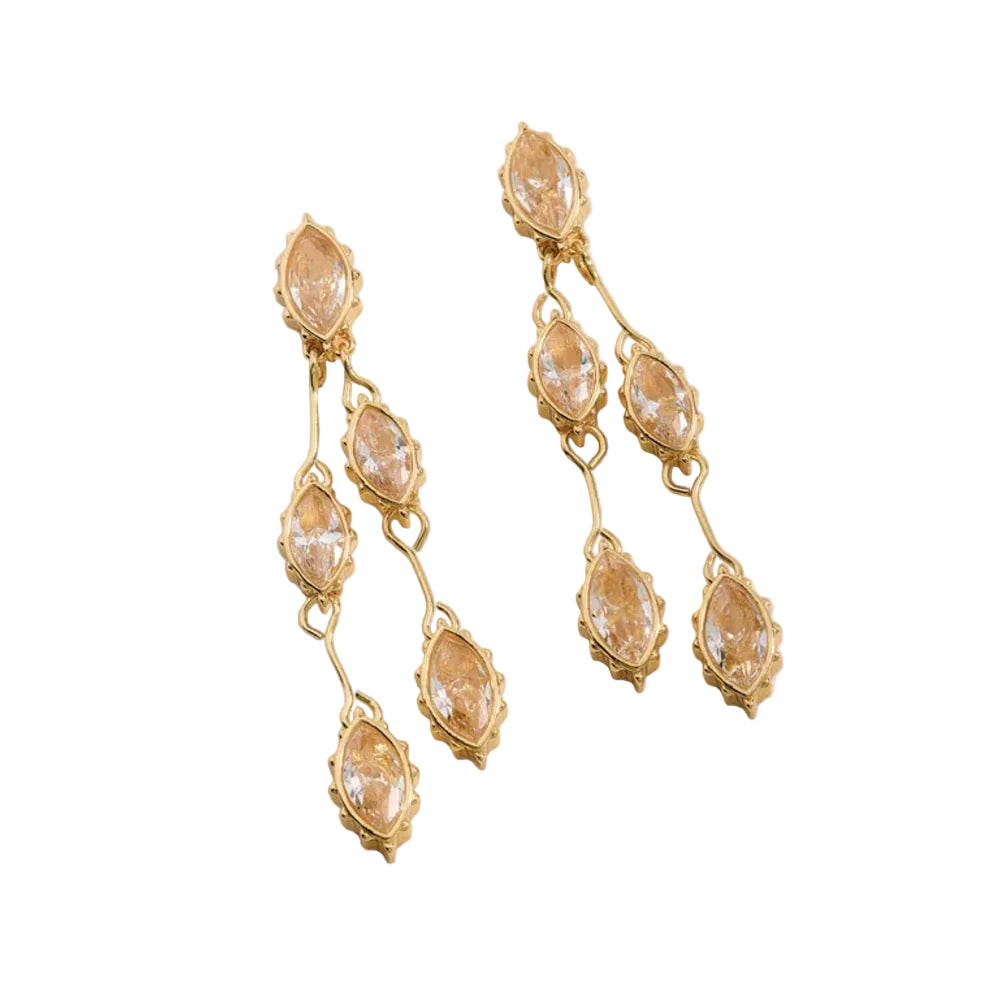 Drop earrings featuring 18kt shiny gold plating and marquise cut glass crystals set against a white background.