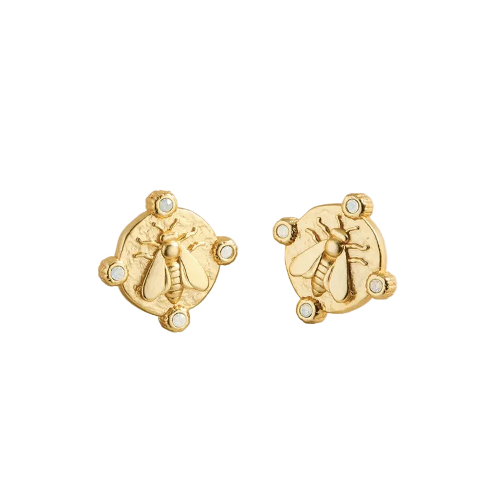 A pair of gold-tone stud earrings featuring an embossed bee design on a circular medallion, accented with four small white stones around the edge, shown on a white background.