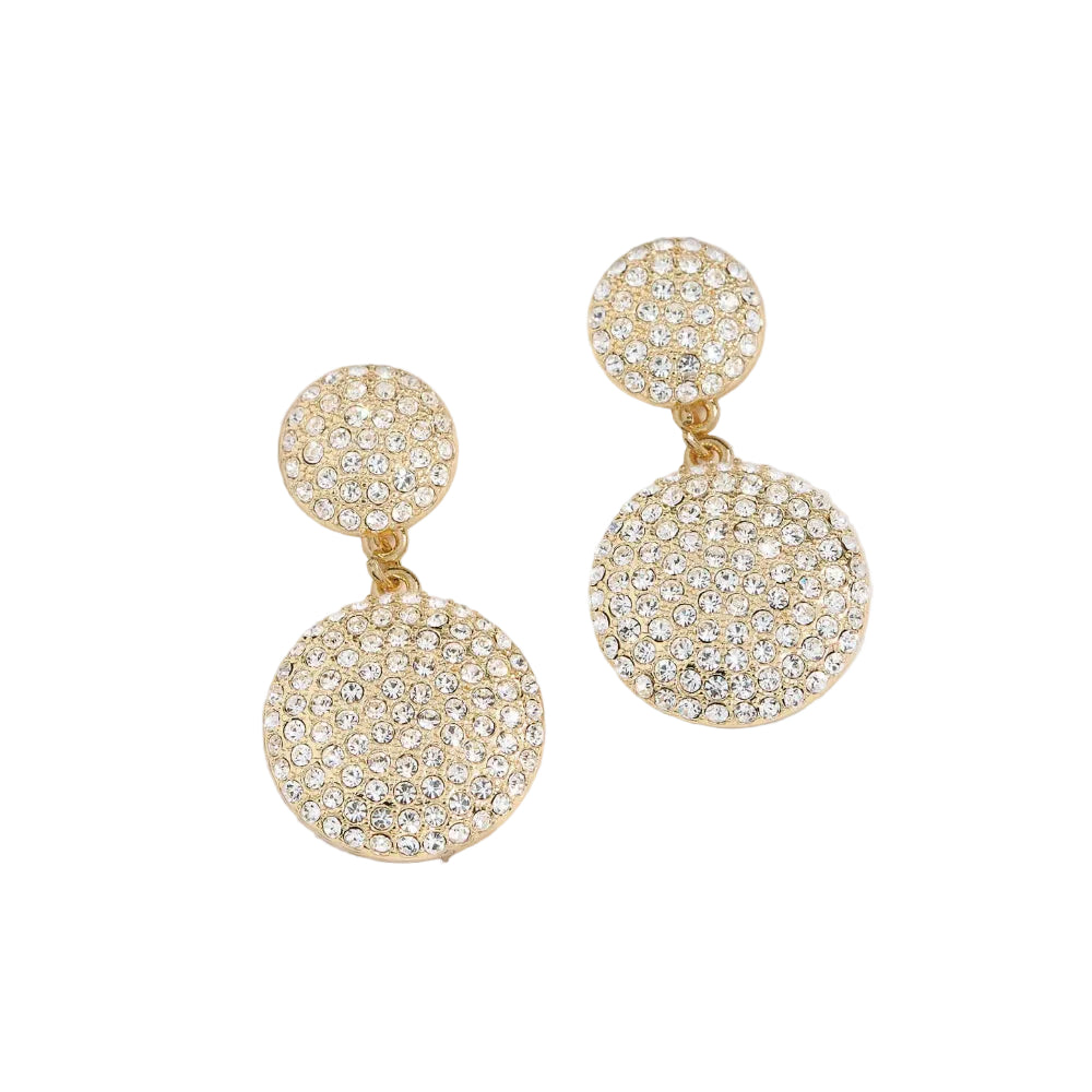 A pair of gold-tone drop earrings with circular pavé crystal clusters, featuring a smaller round stud on top and a larger round drop below, set against a white beige background.