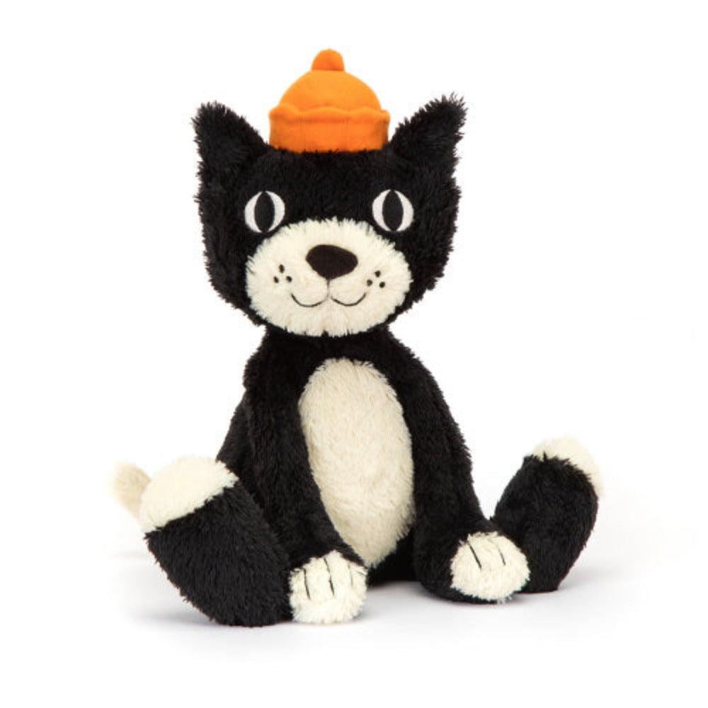 A plush tuxedo cat with a black and white fur, orange stitched paws, and a velour crown.