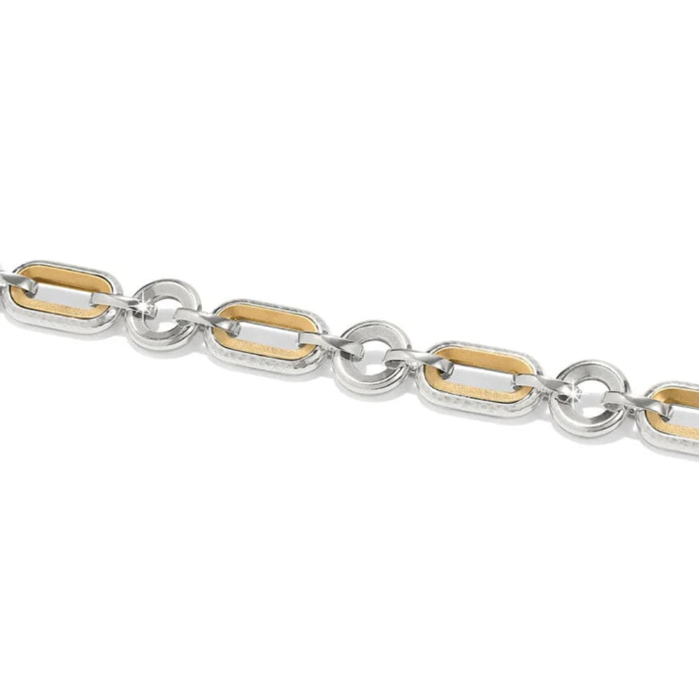 Close-up of a silver and gold chain on a white background