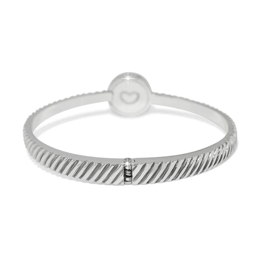 Silver bracelet with a textured band and heart detail on a white background