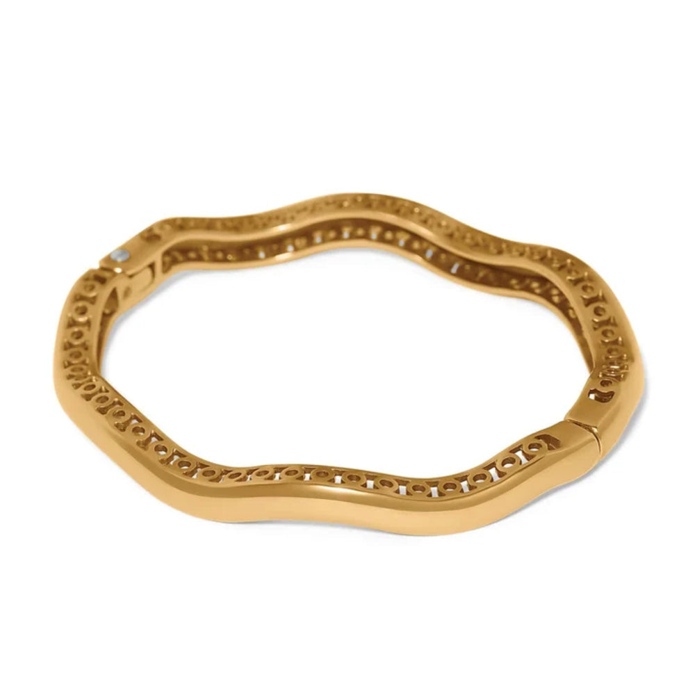 Gold bracelet with intricate design on a white background